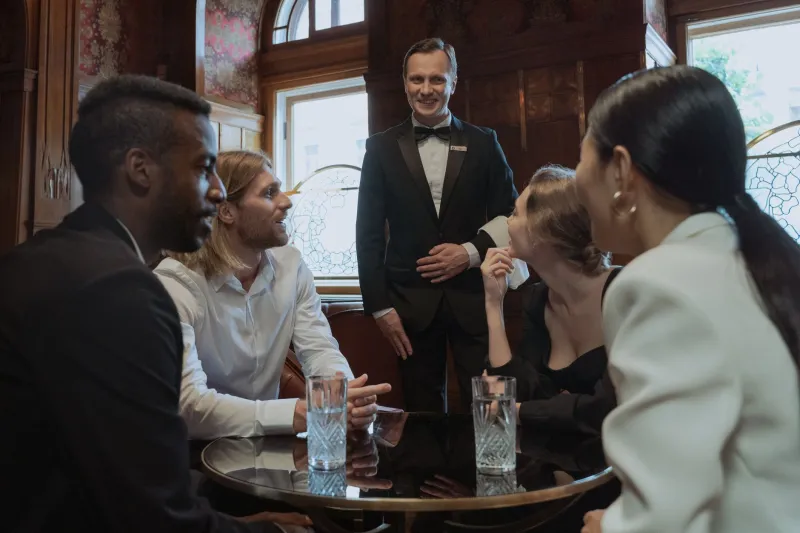 Credibility by Association: The Disciplined Calculus of Referencing Names at High-Stakes Business Dinners